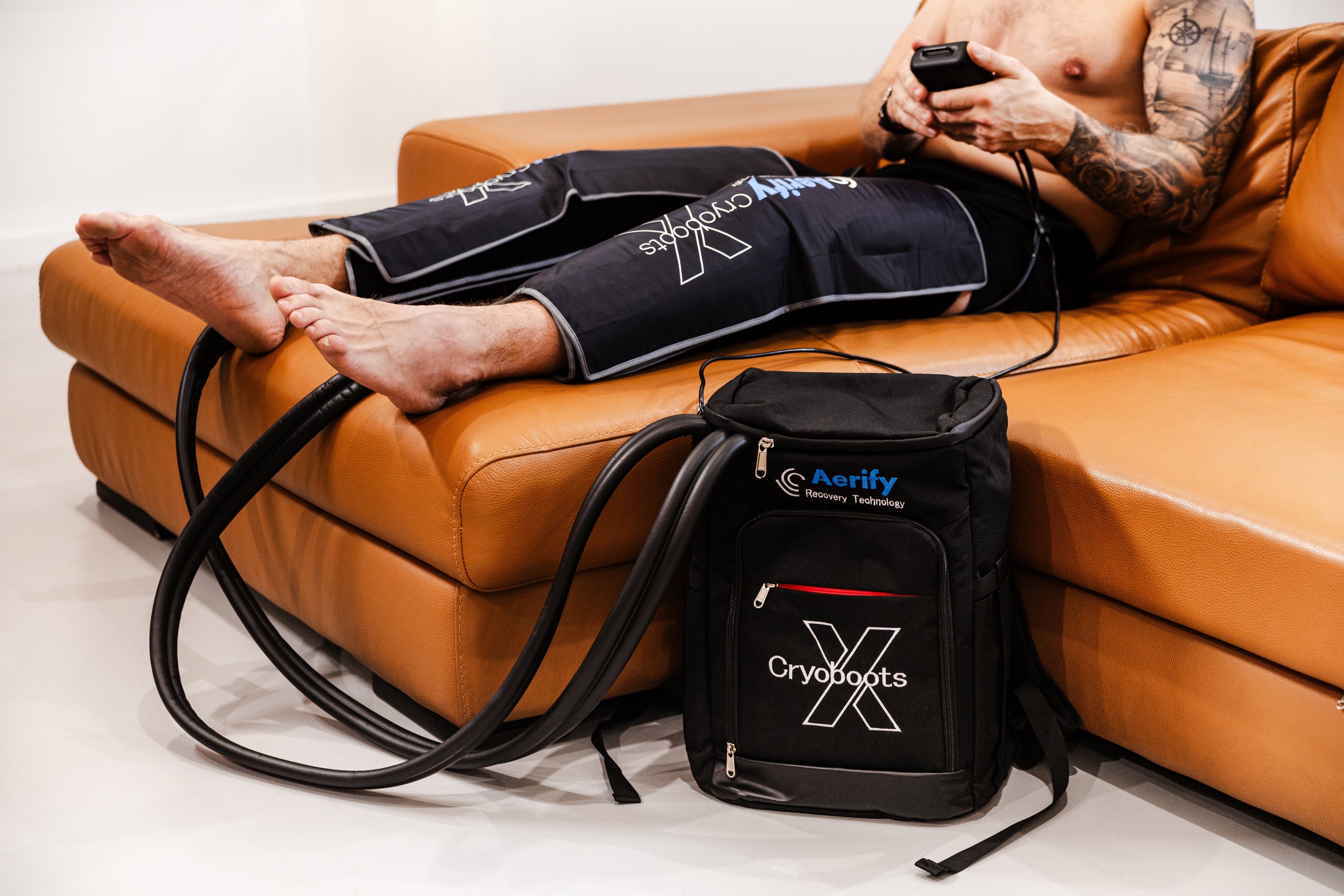 Aerify Cryoboots X cold compression boots kit with insulated bag and attachments.