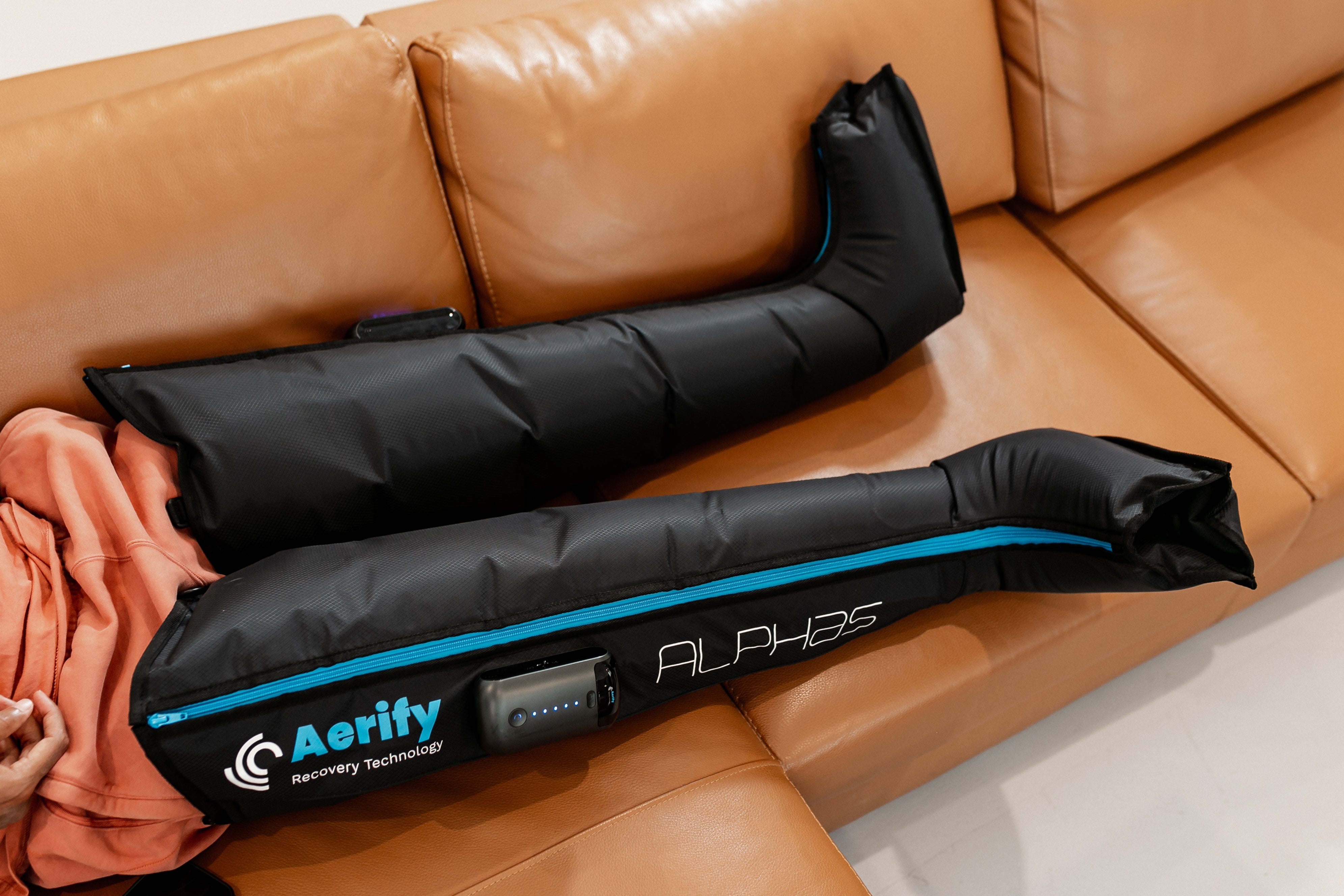 Aerify Wireless Alphas Compression Boots front product view with travel bag.