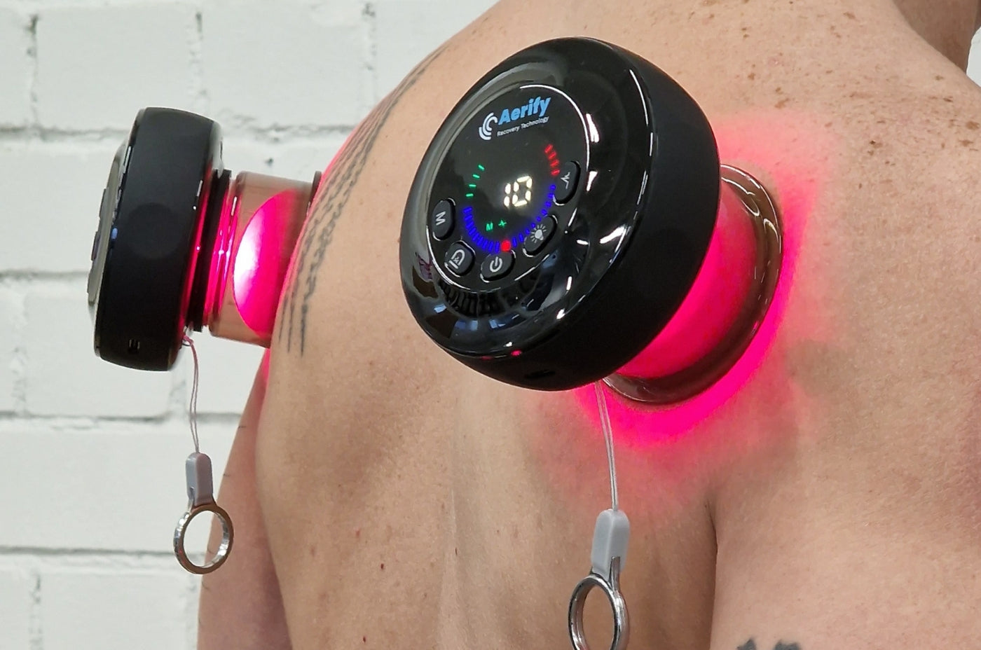 Aerify Dynamic Cupping Red Light Therapy Device with remote and carry case.