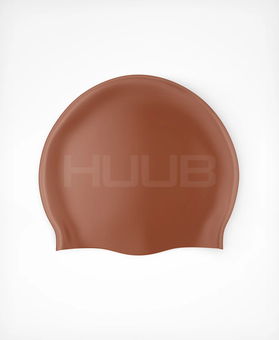 Bright orange HUUB silicone swim cap with a smooth, snug fit, designed for comfortable swimming and water resistance.