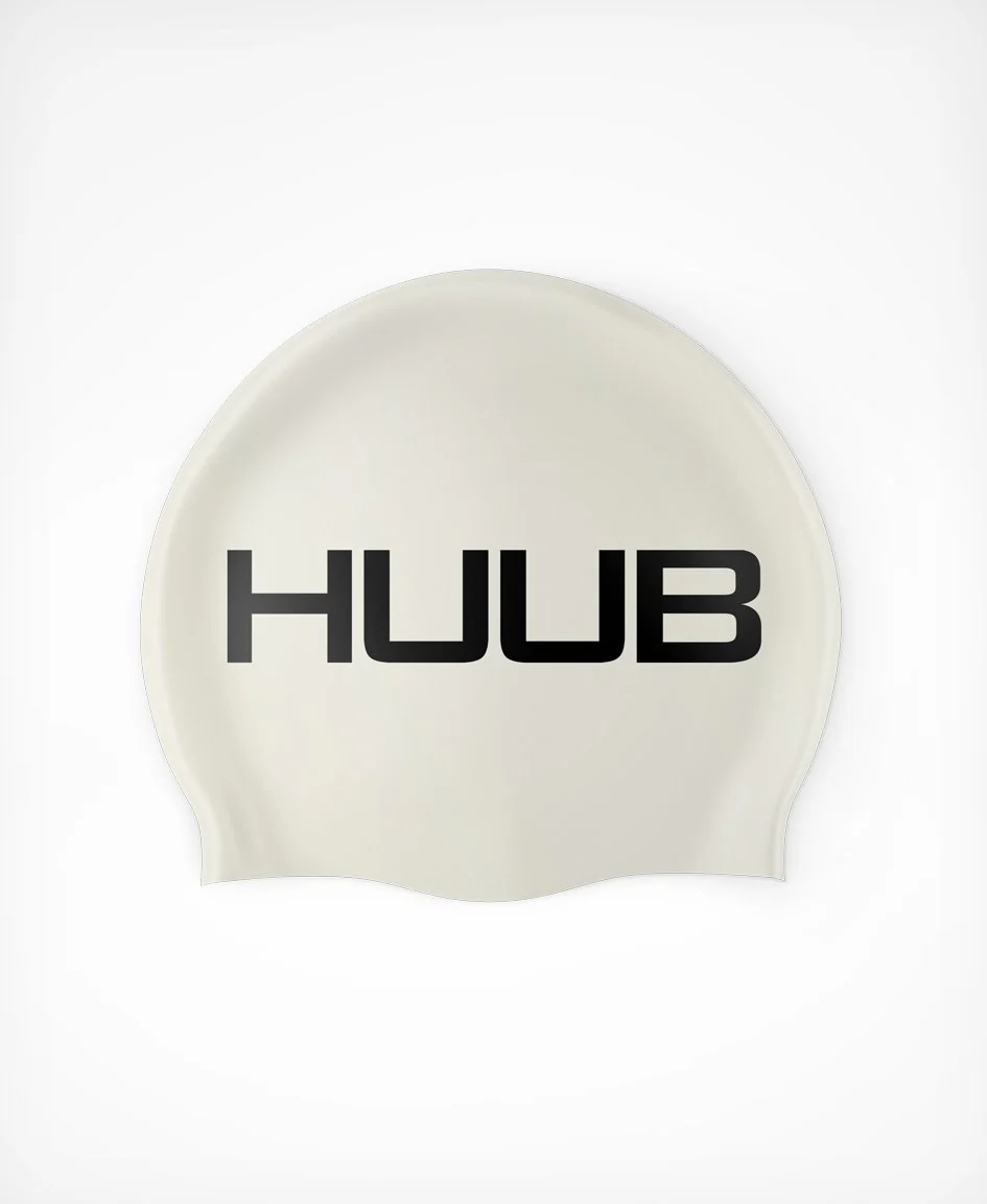 Bright orange HUUB silicone swim cap with a smooth, snug fit designed for comfortable swimming.
