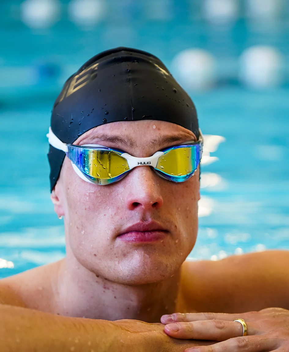 Bright orange HUUB silicone swim cap with a smooth, snug fit for comfortable swimming and optimal hydrodynamics.