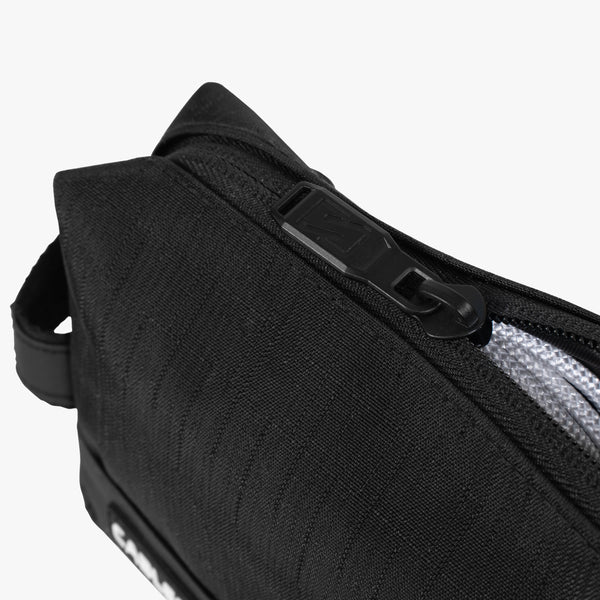 Scicon electronics travel organizer pouch with multiple compartments for cables, chargers, and gadgets in black fabric.
