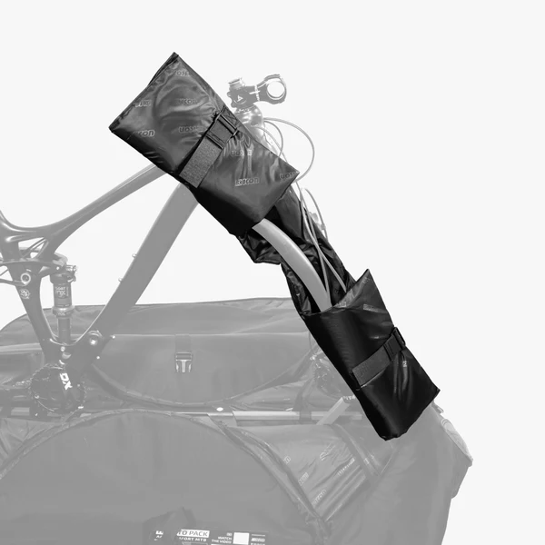 Scicon MTB handlebar protection pad attached to mountain bike handlebar for impact cushioning and safety.