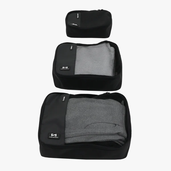 Set of three Scicon travel packing cubes in different sizes for organized luggage storage and efficient packing.