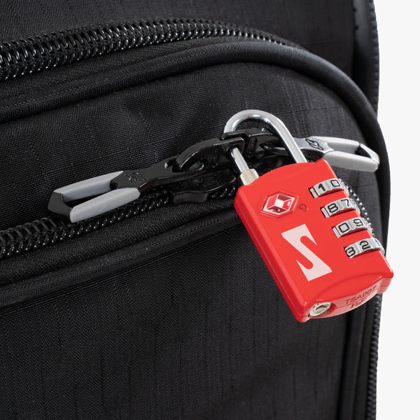 Red Scicon TSA luggage padlock with keyhole and combination dials for secure travel baggage protection.
