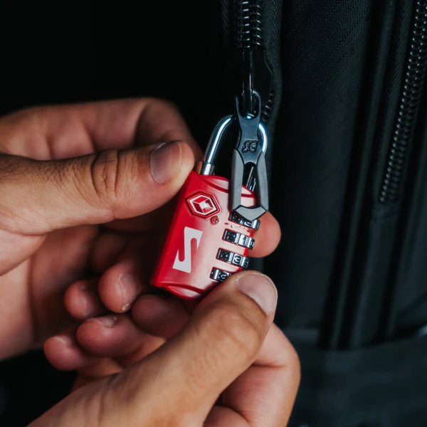 Red Scicon TSA luggage padlock with keyhole and combination dial for secure travel luggage.