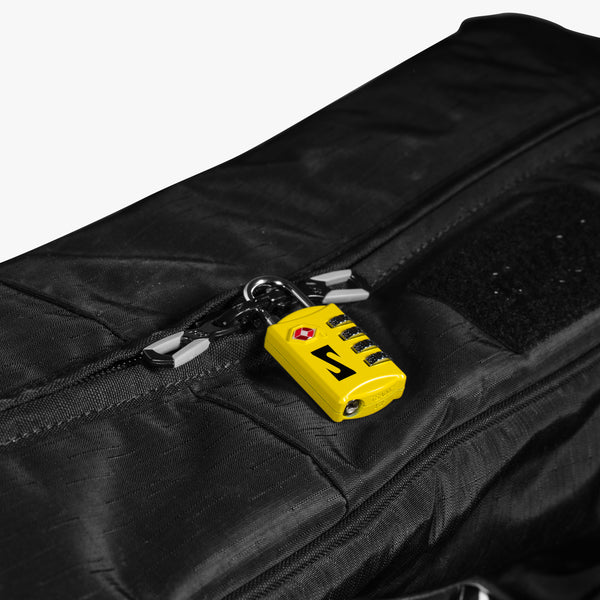 Red Scicon TSA luggage padlock with keyhole and combination dial for secure travel baggage.